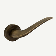 PLANE Lever Handle on rose - Bronze Fin